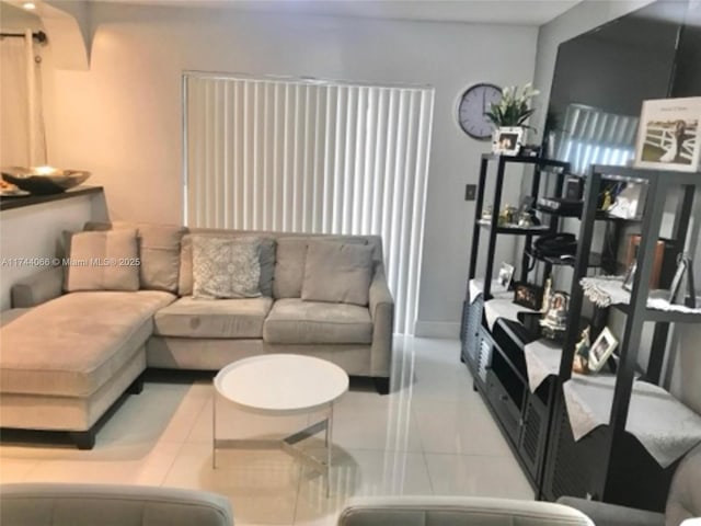 living room featuring light tile patterned flooring