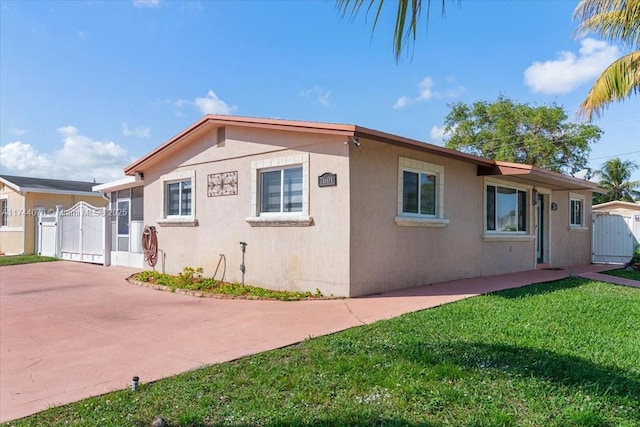 view of side of property with a yard