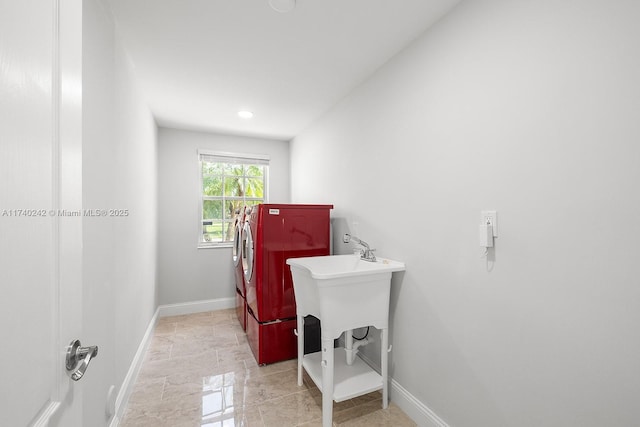 clothes washing area with independent washer and dryer