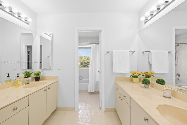 bathroom with shower / tub combo with curtain and vanity