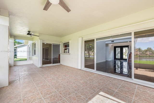 view of patio with ceiling fan and french doors