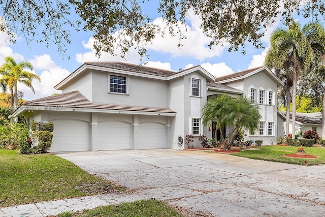 front facade featuring a front yard and a garage