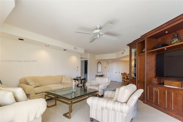 living room with light tile patterned floors and ceiling fan