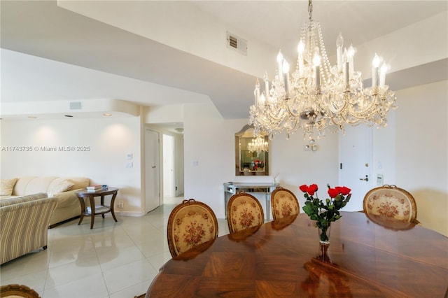 dining area with an inviting chandelier and light tile patterned floors