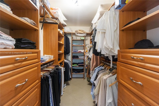 walk in closet featuring light tile patterned floors