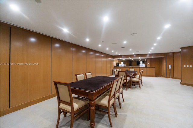 dining area featuring light colored carpet