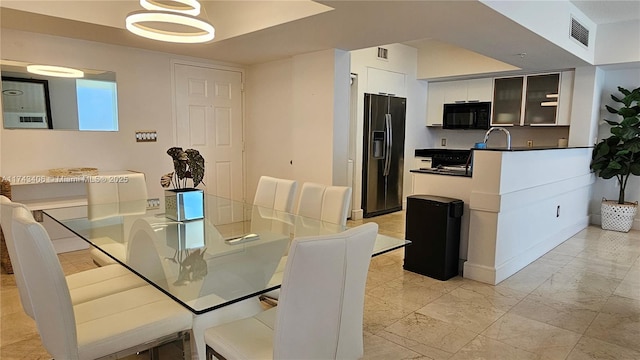 dining room featuring sink