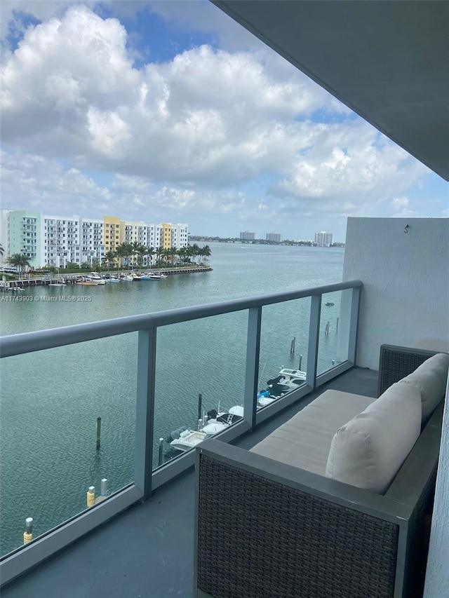 balcony featuring a water view