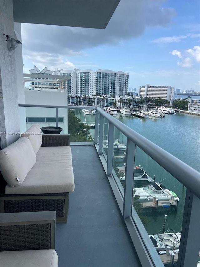 balcony featuring a water view