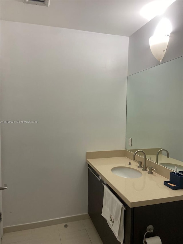 bathroom featuring vanity and tile patterned flooring