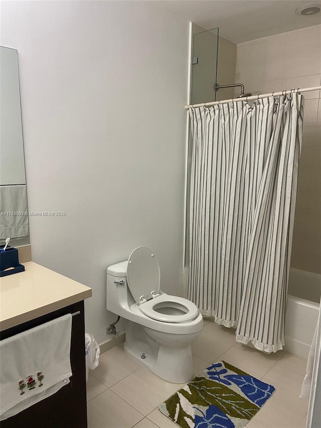 full bathroom featuring vanity, tile patterned floors, toilet, and shower / bath combo