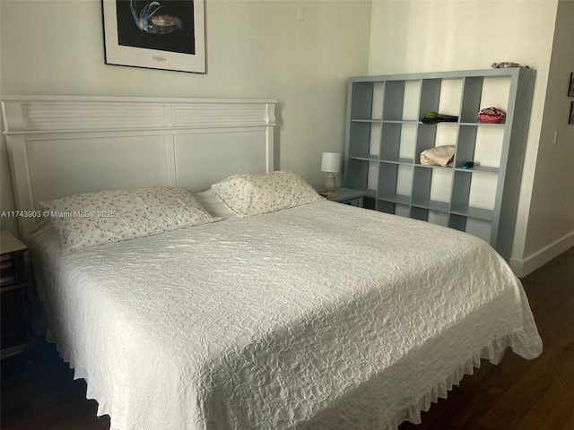 bedroom featuring dark hardwood / wood-style flooring