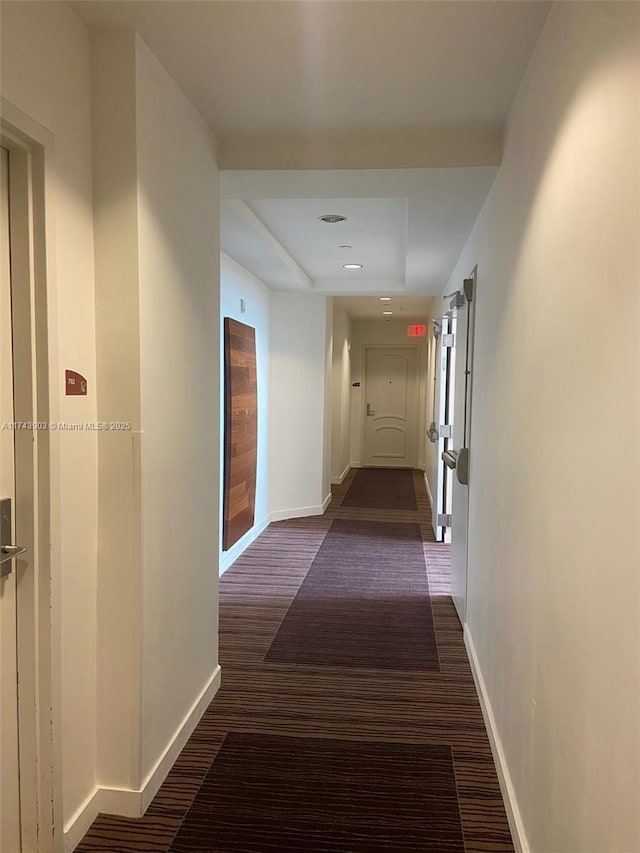 hall featuring dark wood-type flooring