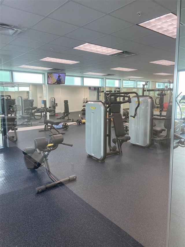 workout area featuring a paneled ceiling