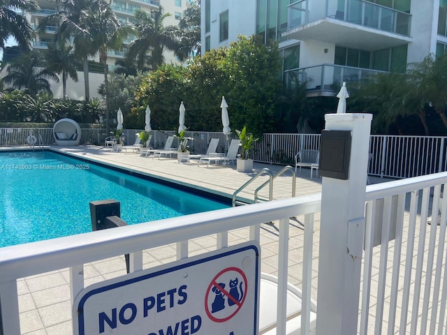 view of swimming pool with a patio