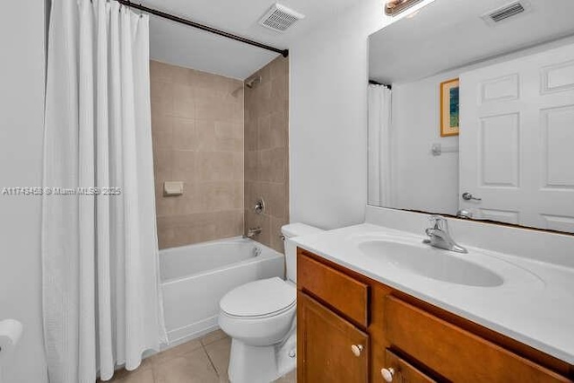 full bathroom featuring vanity, shower / bathtub combination with curtain, tile patterned floors, and toilet