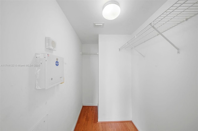 walk in closet featuring wood-type flooring