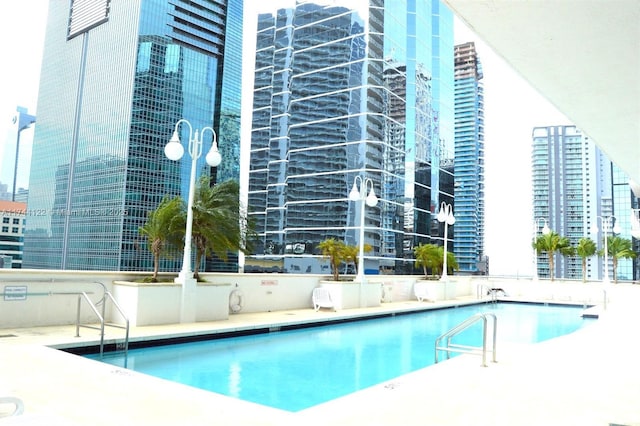 view of swimming pool featuring a patio area