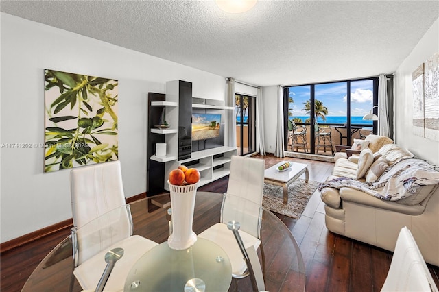 2555 Collins Ave Unit 403, Miami Beach, FL 33140 - living area with a textured ceiling, hardwood / wood-style flooring, and baseboards