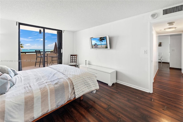 2555 Collins Ave Unit 403, Miami Beach, FL 33140 - bedroom featuring access to outside, hardwood / wood-style floors, a textured ceiling, floor to ceiling windows, and baseboards