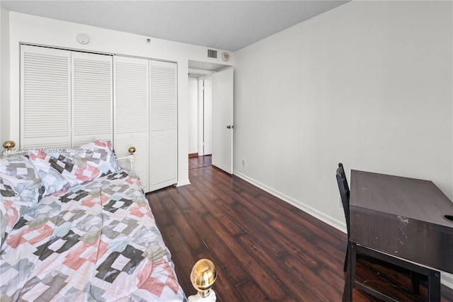 2555 Collins Ave Unit 403, Miami Beach, FL 33140 - bedroom featuring wood finished floors, baseboards, and a closet
