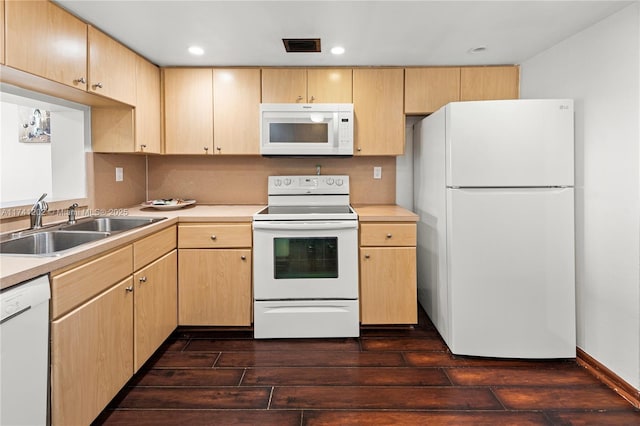2555 Collins Ave Unit 403, Miami Beach, FL 33140 - kitchen featuring white appliances, a sink, light brown cabinets, dark wood-style flooring, and light countertops