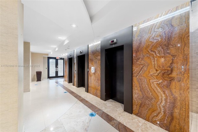 2555 Collins Ave Unit 403, Miami Beach, FL 33140 - hall featuring elevator and recessed lighting