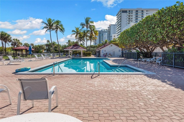 2555 Collins Ave Unit 403, Miami Beach, FL 33140 - community pool with a gazebo and a patio