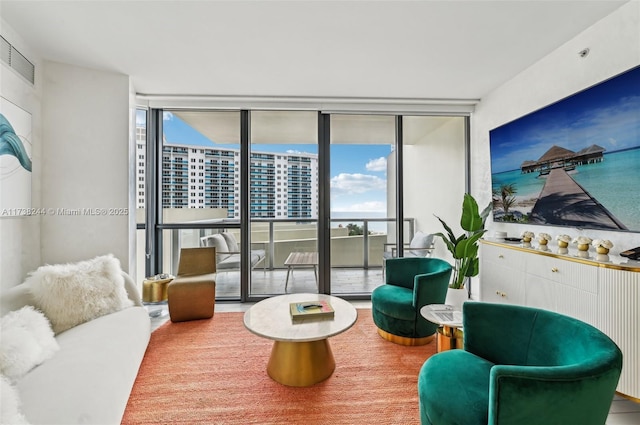 2201 Collins Ave Unit 811, Miami Beach, FL 33139 - living room featuring a wall of windows