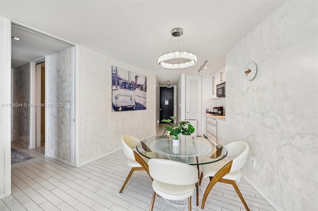 2201 Collins Ave Unit 811, Miami Beach, FL 33139 - dining room with a chandelier