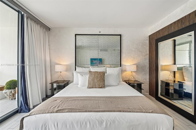 2201 Collins Ave Unit 811, Miami Beach, FL 33139 - bedroom featuring access to outside and wood finished floors