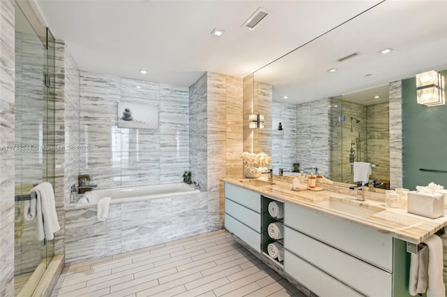 2201 Collins Ave Unit 811, Miami Beach, FL 33139 - bathroom featuring a bath, a shower stall, vanity, and recessed lighting
