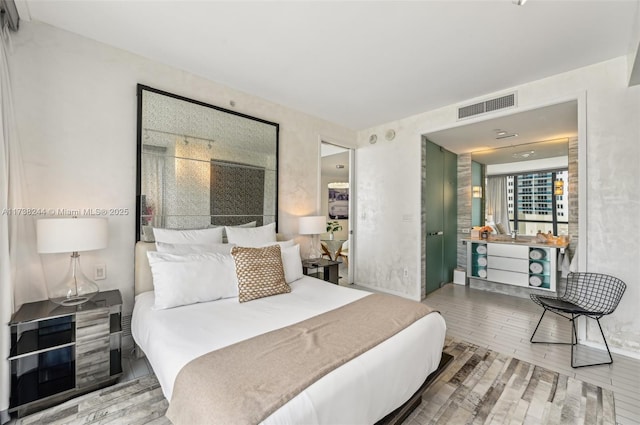 2201 Collins Ave Unit 811, Miami Beach, FL 33139 - bedroom with wood finished floors
