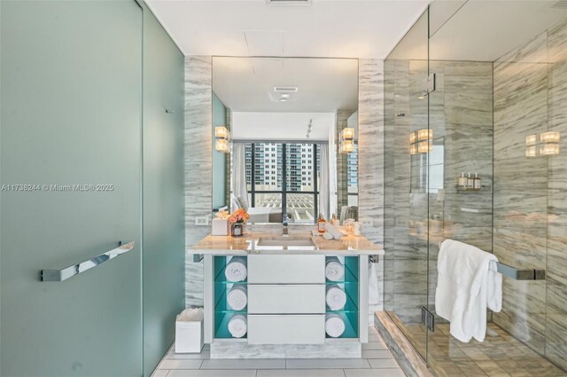 2201 Collins Ave Unit 811, Miami Beach, FL 33139 - full bathroom with a stall shower, vanity, and tile patterned floors