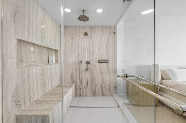 bathroom with recessed lighting and a marble finish shower