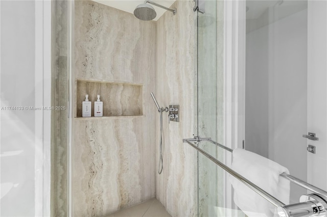 full bath featuring a marble finish shower