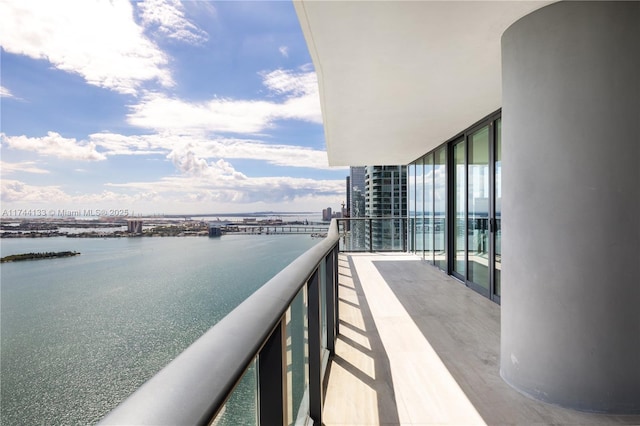 balcony featuring a water view