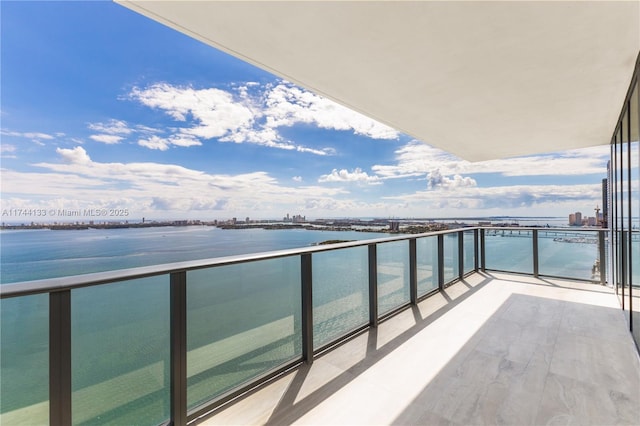 balcony featuring a water view