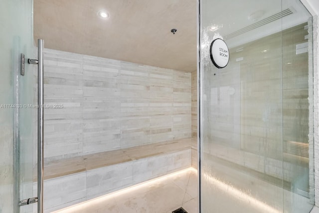 bathroom featuring tiled shower