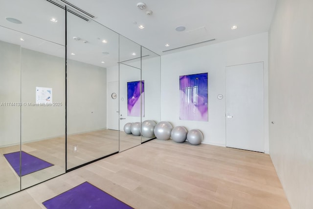 exercise area featuring wood finished floors