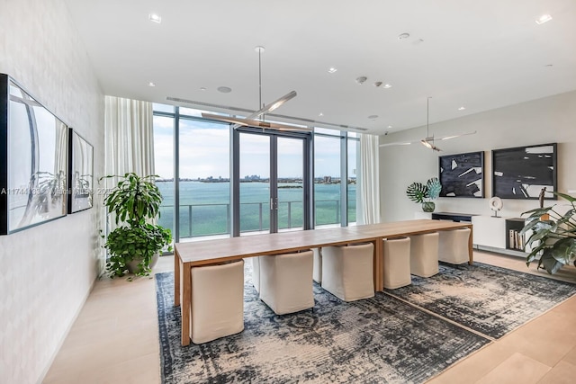 kitchen featuring a water view, wood counters, and floor to ceiling windows