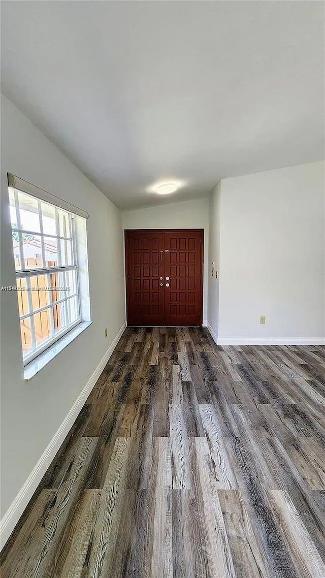 spare room featuring dark hardwood / wood-style floors