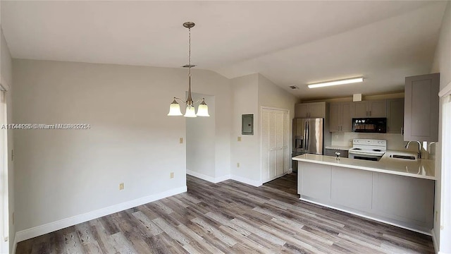 kitchen with sink, electric panel, stainless steel refrigerator with ice dispenser, white range with electric stovetop, and decorative light fixtures