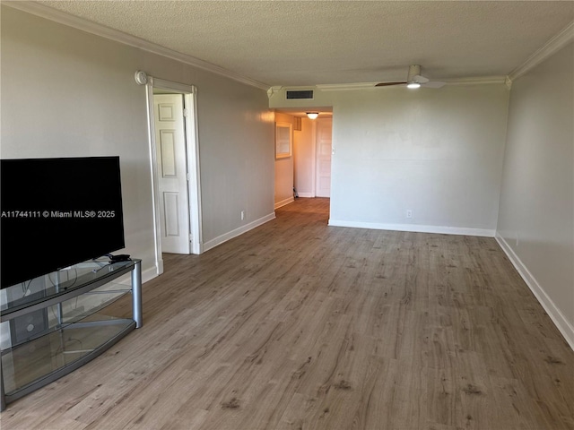 living room with crown molding, wood-type flooring, a textured ceiling, and ceiling fan