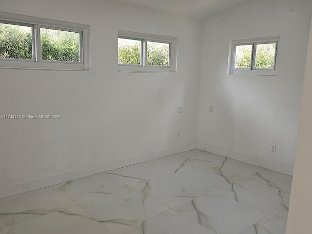 spare room with a wealth of natural light