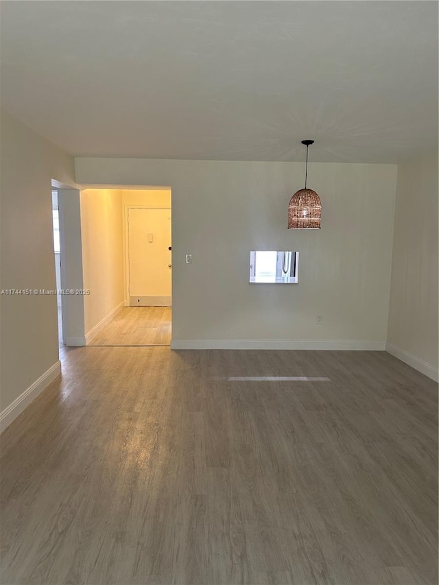 unfurnished room featuring wood-type flooring