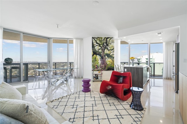 tiled living room featuring expansive windows