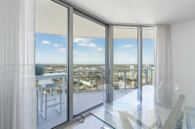 interior space featuring a wealth of natural light, tile patterned floors, and expansive windows