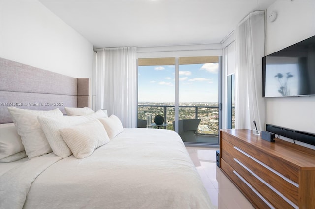 tiled bedroom featuring floor to ceiling windows