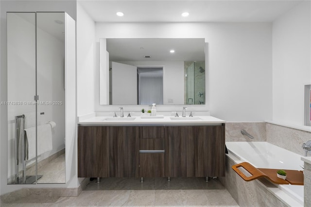 bathroom with vanity and plus walk in shower